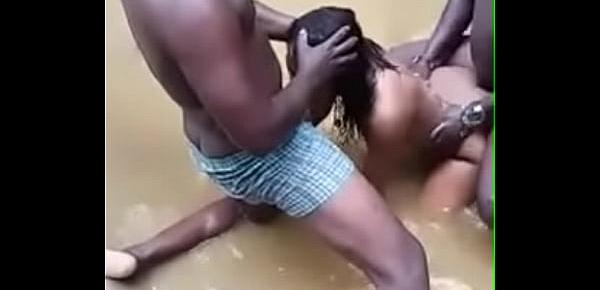  2  men fucking her in a river